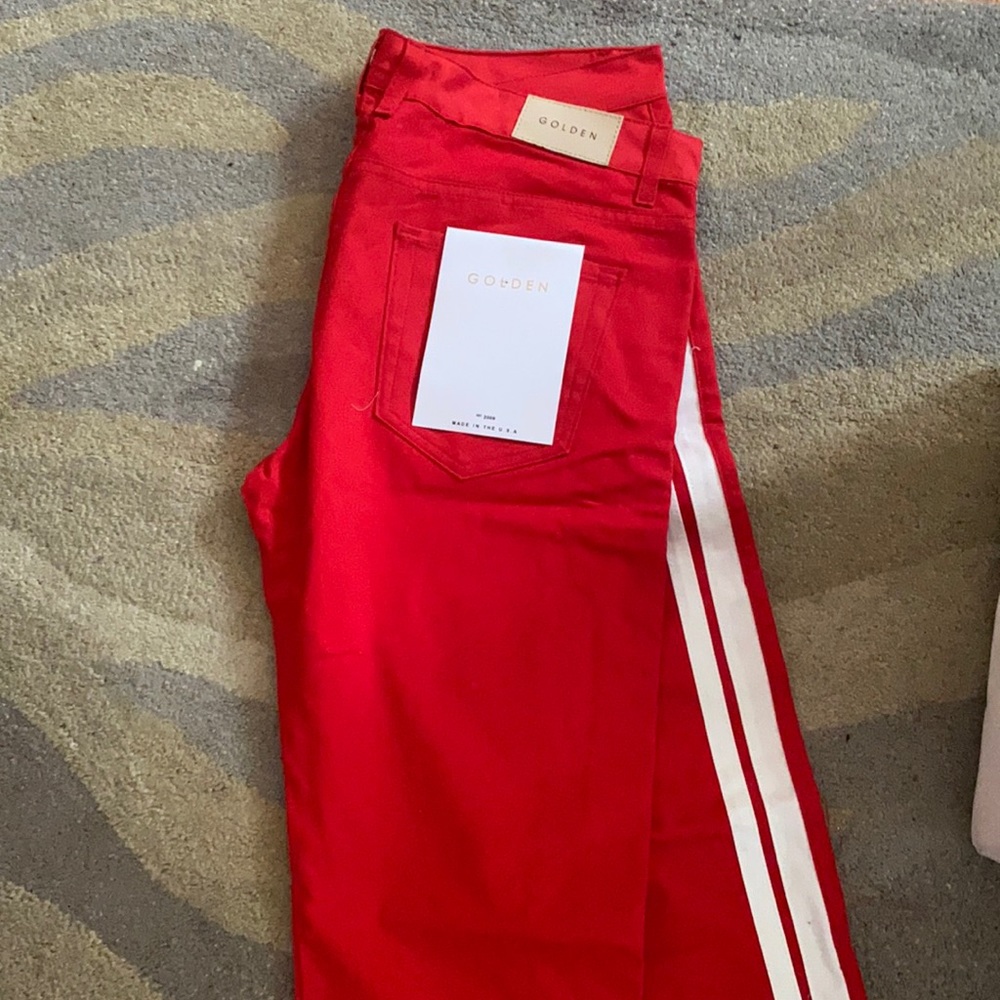 Red and white new jeans with tags Golden denim